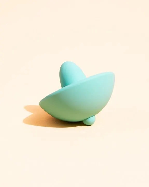 Vibromasseur en silicone turquoise élégant et discret, idéal pour des moments intimes de plaisir.