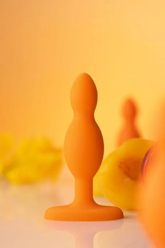 Plug anal en silicone orange, design ergonomique, parfait pour le plaisir intime et la découverte sensorielle.