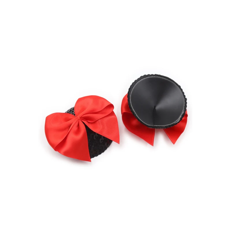 Paire de cache tétons adhésifs noir avec nœud papillon rouge