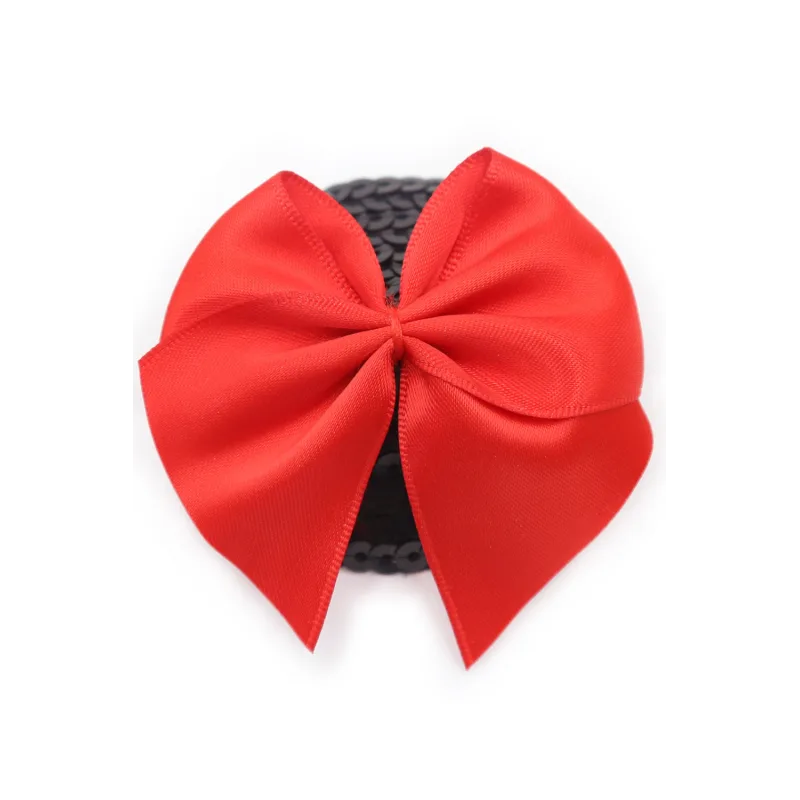 Paire de cache tétons adhésifs noir avec nœud papillon rouge
