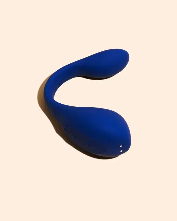 Vibromasseur intime en silicone bleu ergonomique et flexible.