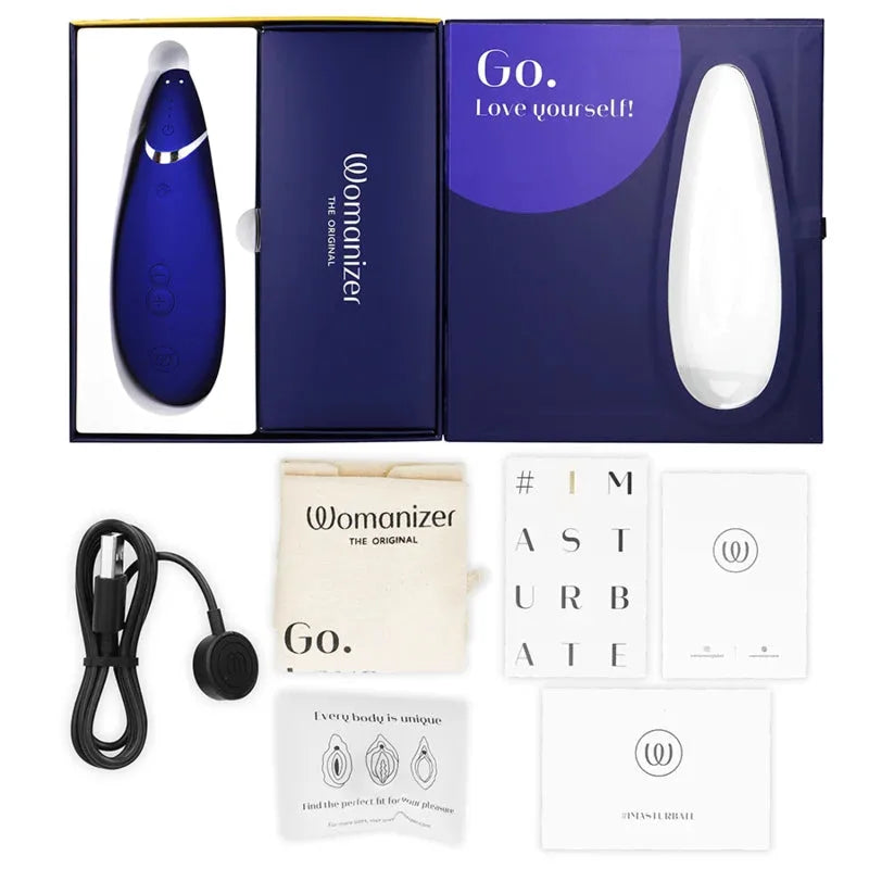 Stimulateur clitoridien Womanizer bleu élégant avec accessoires inclus, technologie sans contact pour plaisir intense.