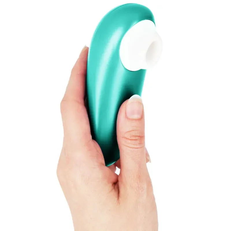 Stimulateur clitoridien vert en silicone, ergonomique et compact, idéal pour le plaisir féminin discret.