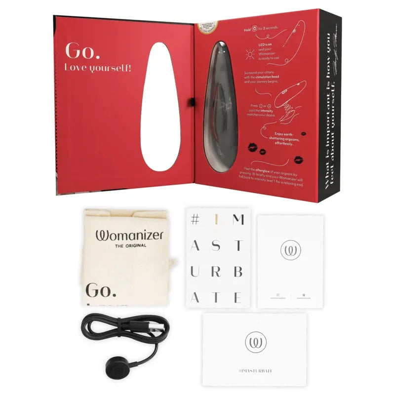Ensemble Womanizer Premium, stimulateur clitoridien noir avec accessoires, plaisir garanti pour moments intimes intenses.