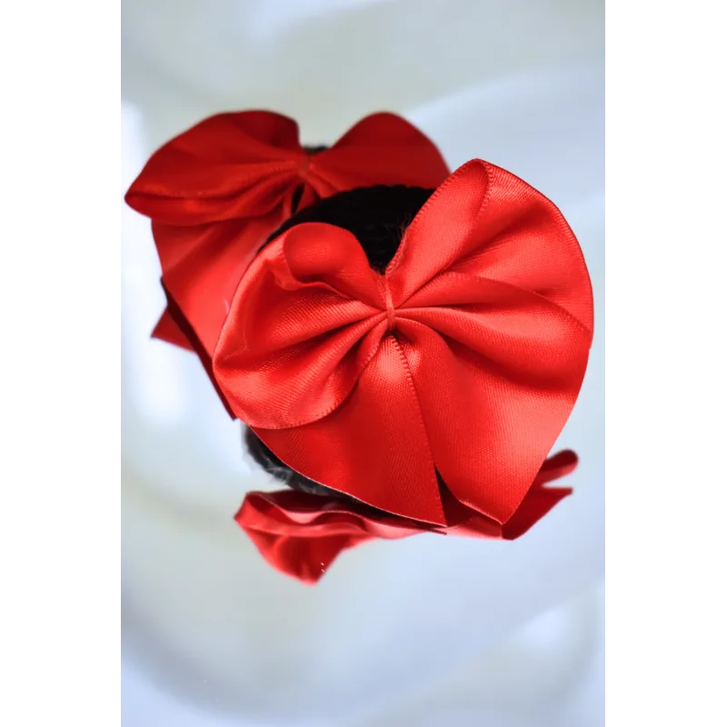 Paire de cache tétons adhésifs noir avec nœud papillon rouge